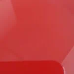 A close up of a red plastic plate.