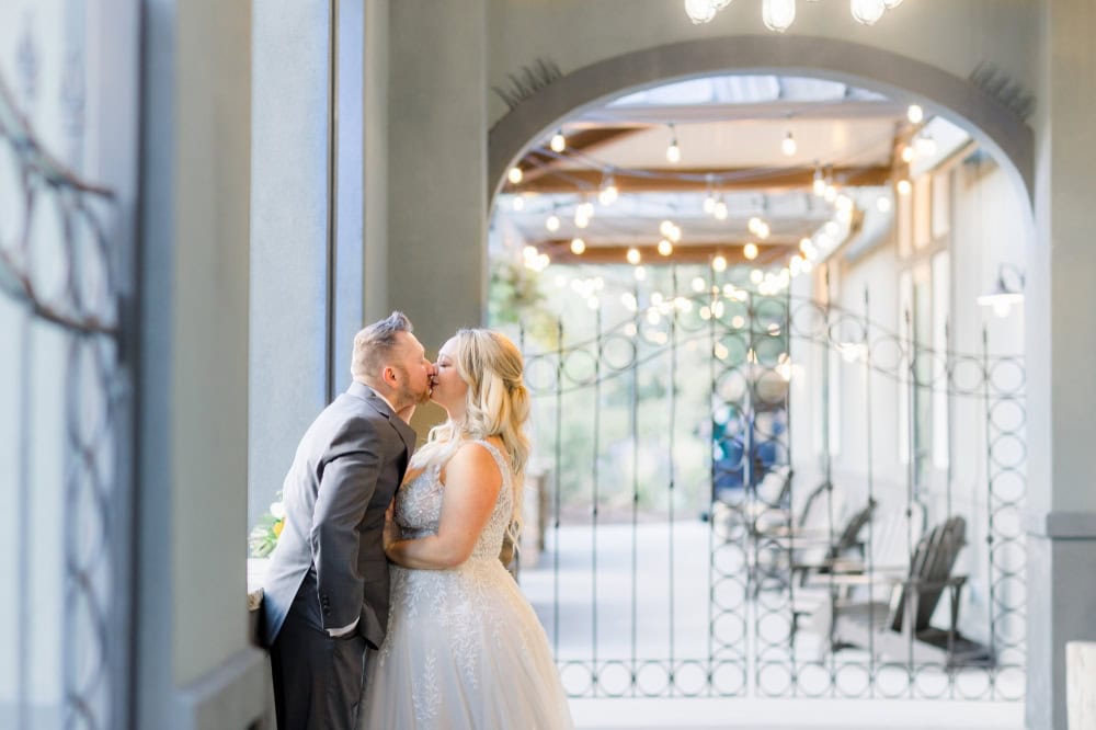 Bride and Groom sharing a private kiss