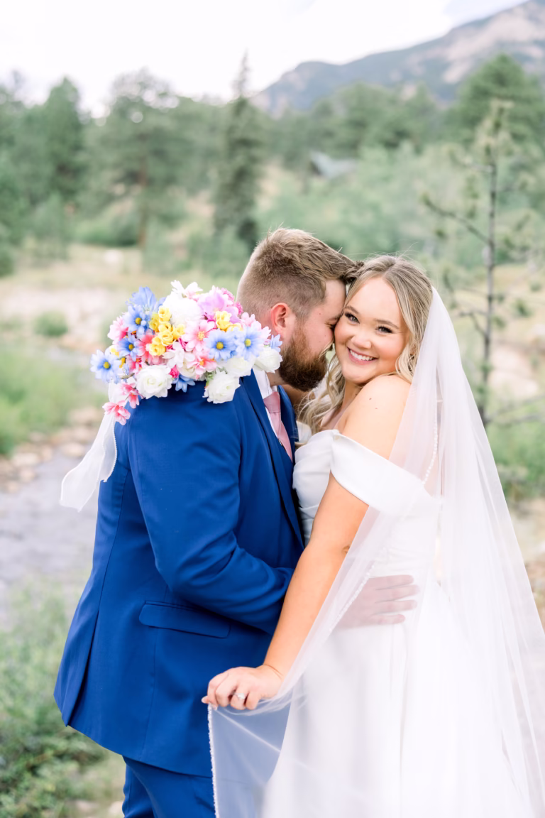 Groom telling the bride a cute secret that made her smile