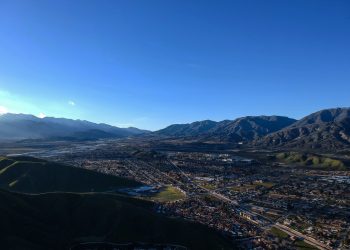 Scenic View Of Mountains Against Clear Blue Sky