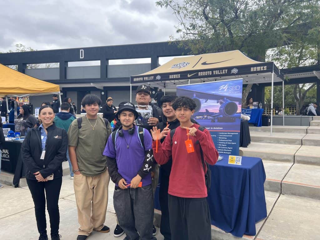 Female airport representative at career fair at Arroyo Valley High School