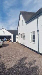White exterior house painting with durable weatherproof finish in UK homes.