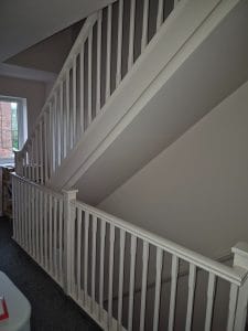 Polished white staircase with railing, interior home decor, professional painting, decorating service.