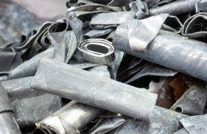 Pile of assorted scrap metal ready for weighing and payment.