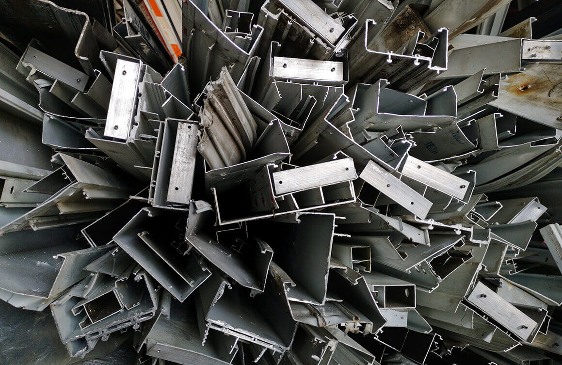 Pile of aluminium scrap metal for recycling at scrap yard.