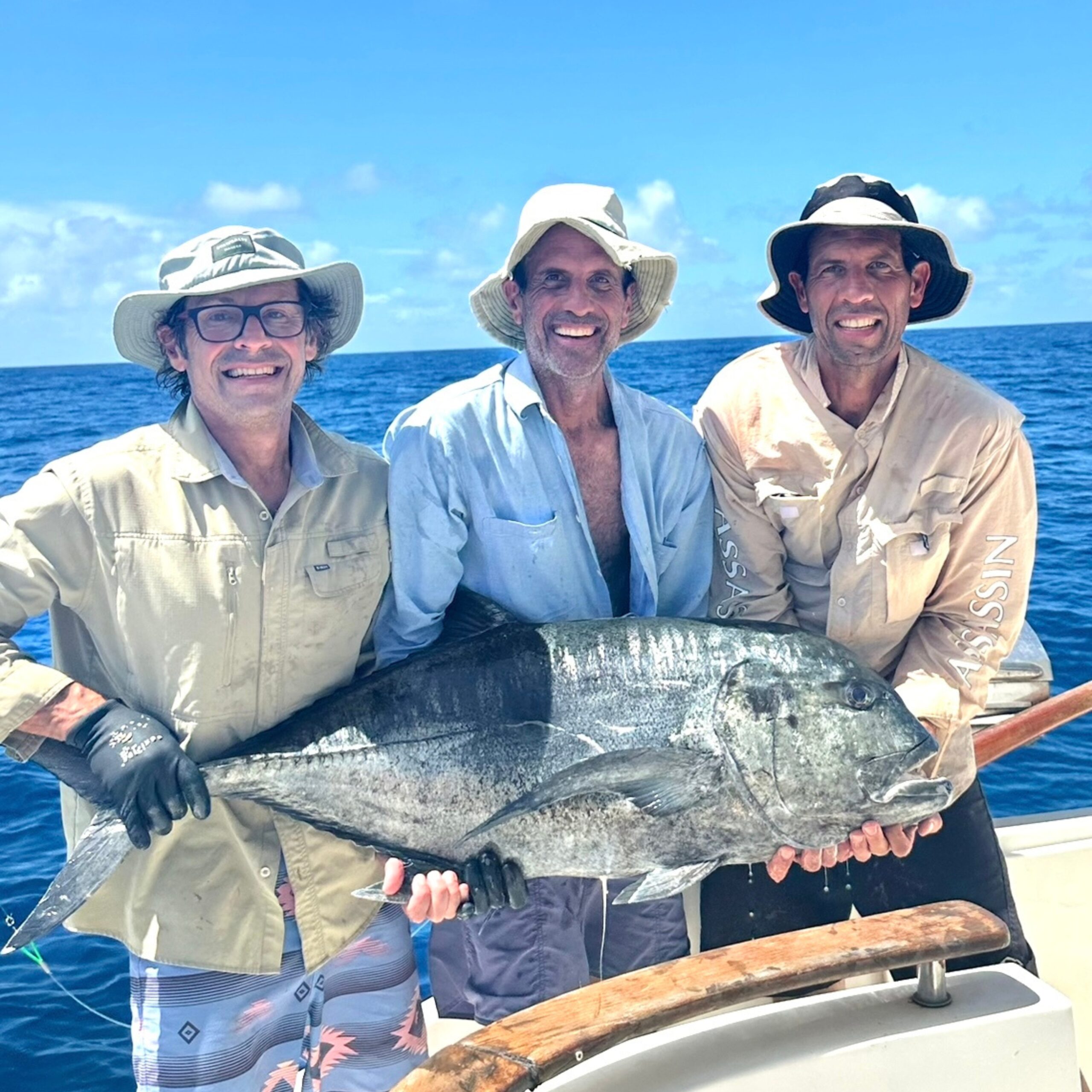 Anglers holding a large GT at African Banks Seychelles prior to release