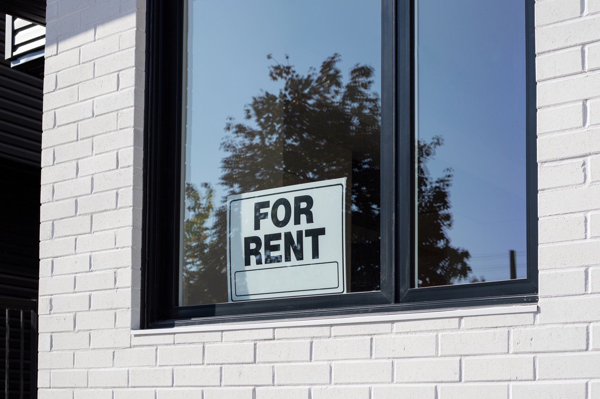 For Rent sign on window of a building window