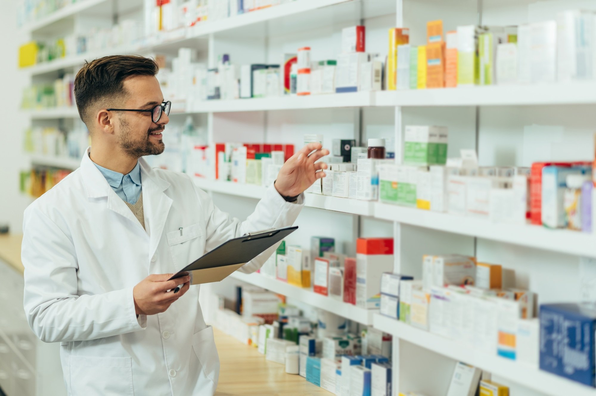 Portrait of a handsome pharmacist working in a pharmacy