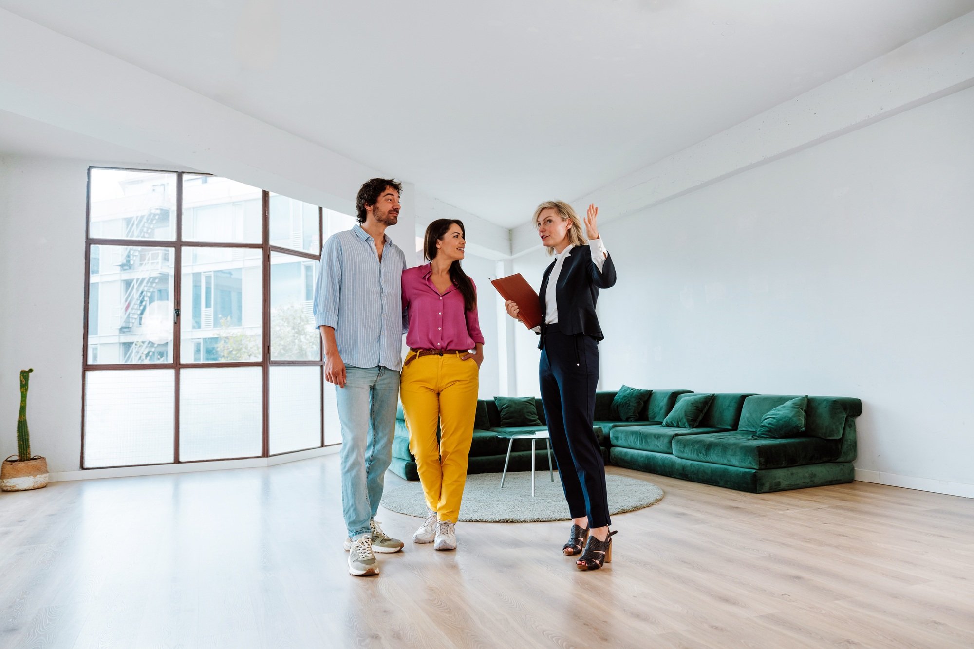 Real estate agent showing an apartment to a couple.