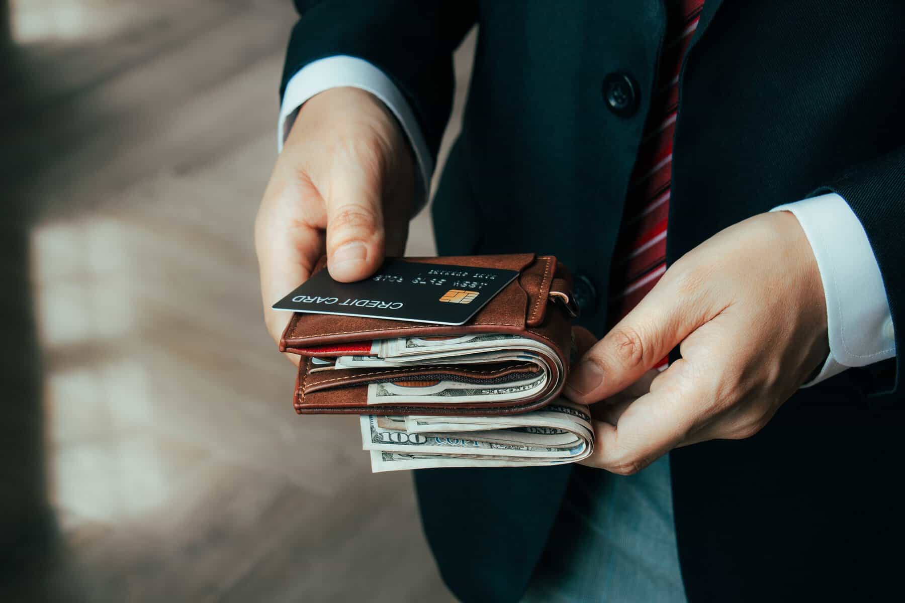 Concept of savings and finance Financial economy, saving money. Businessman takes out