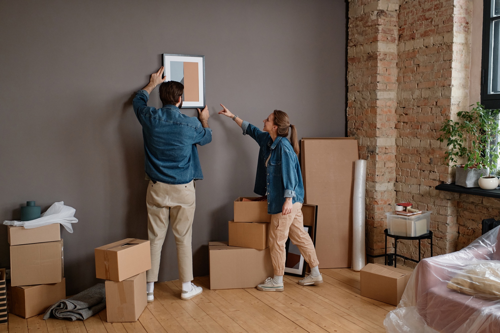 Couple Choosing Place For Paintings