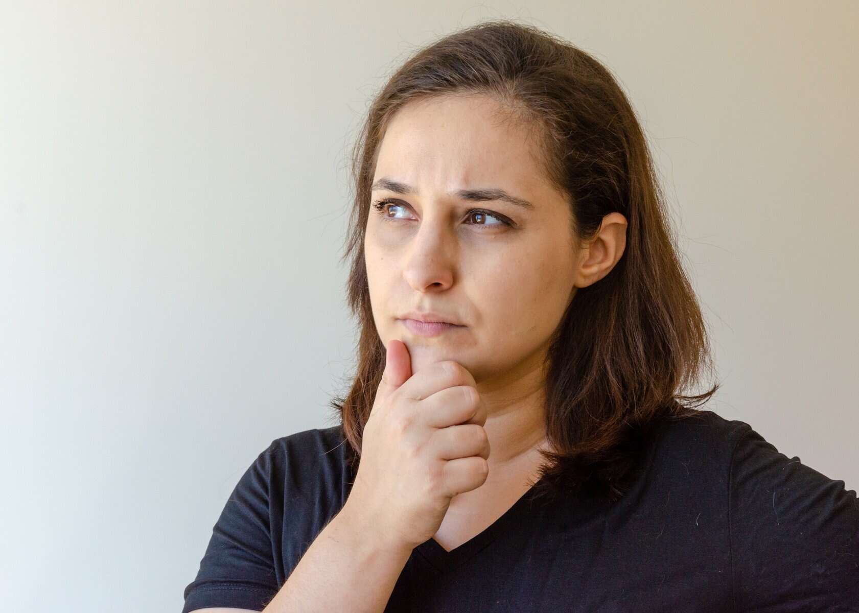 latin woman with suspicious face