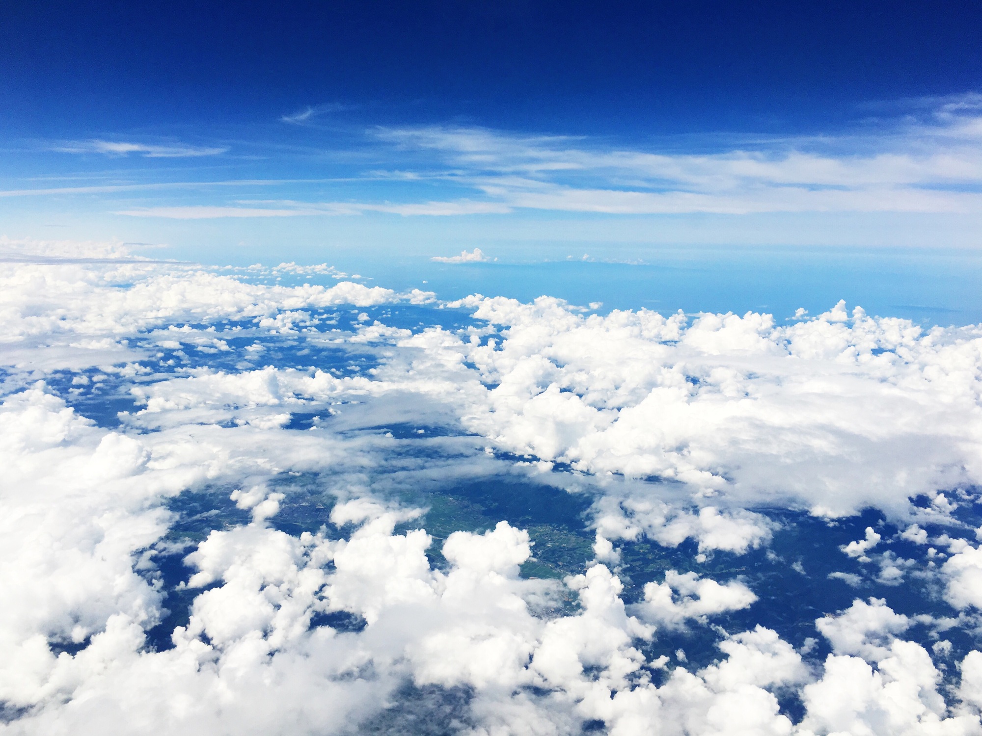 Soaring above the clouds. Air travel. Flight. Trip. Blue sky. Plane.
