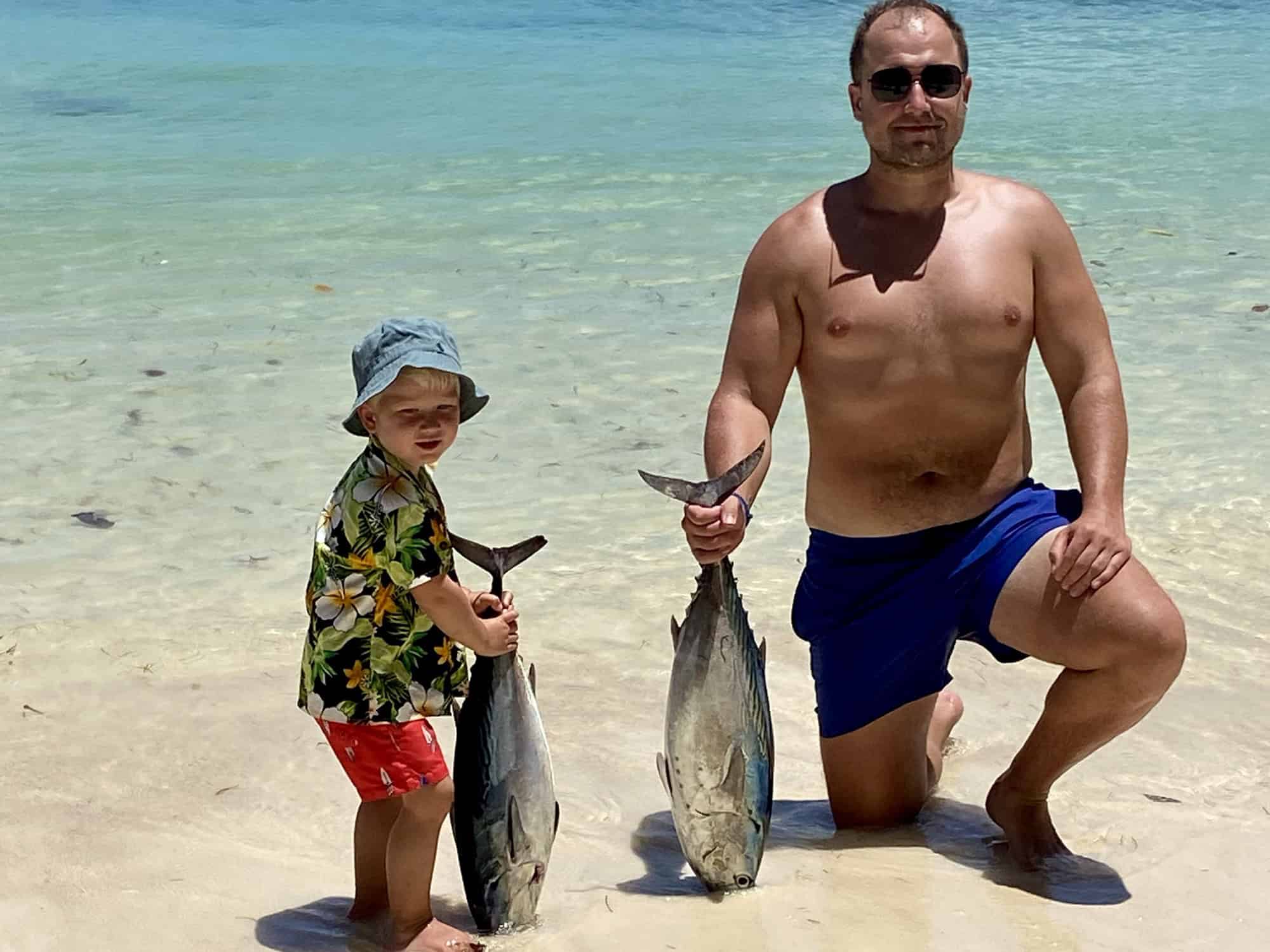 Guests snorkeling over clear reef