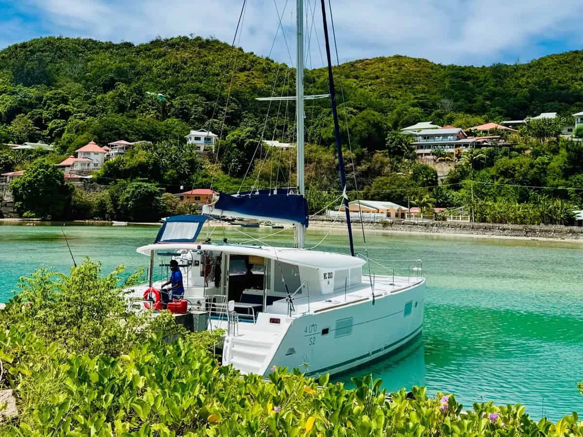 Catamaran at anchor — turquoise lagoon, Praslin