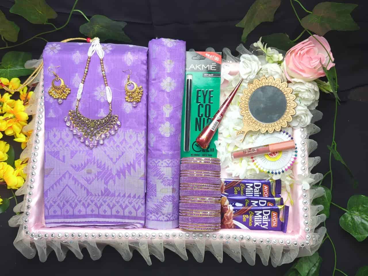 Elegant purple Jamdani saree with matching jewelry and accessories for special occasions.