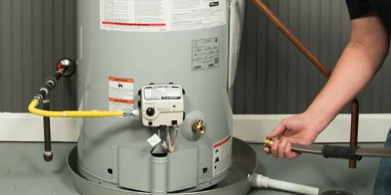 Plumber Servicing Gas Water Heater Connections Sheet Happens Plumbing & Drain