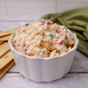 Southern Pimento Cheese paired with crackers for dipping.