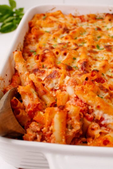 Easy Baked Ziti with Italian Sausage in 9x13 baking dish.