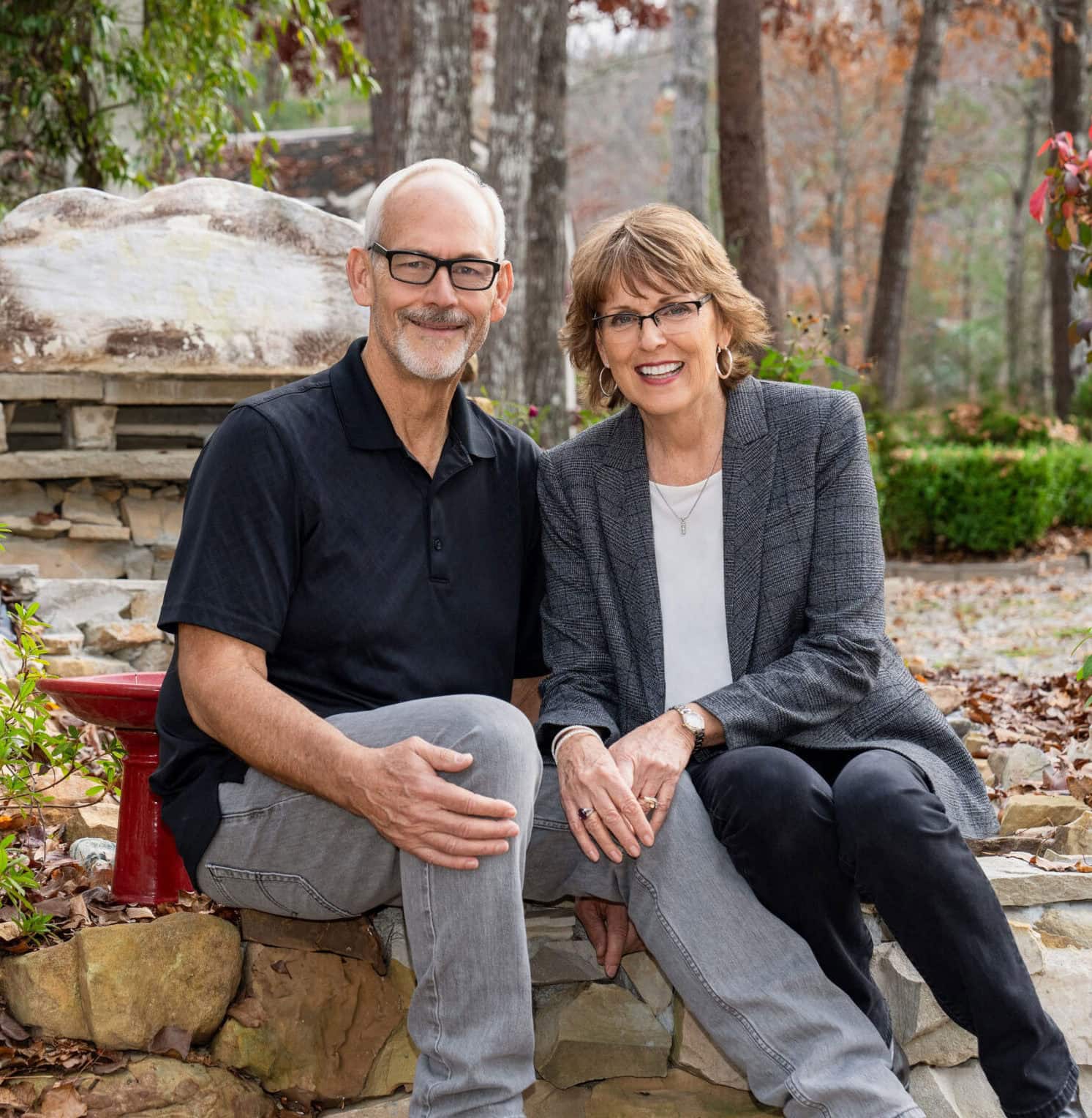 Peaceful outdoor setting with smiling couple, representing Singing Feather Ministries.