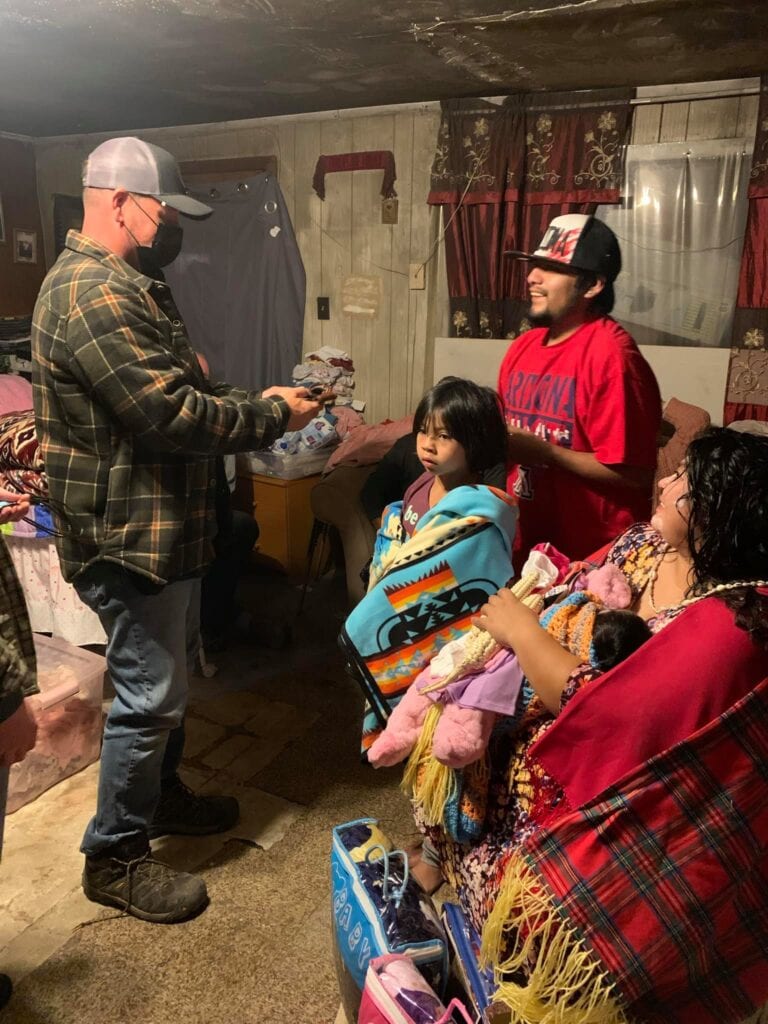 Sharing faith and love during a community outreach event at Singing Feather Ministries.