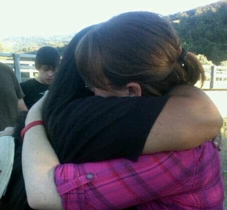 Feeling of comfort and compassion in a heartfelt embrace at Singing Feather Ministries.