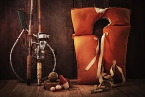 Fishing gear and life vest for water safety and outdoor recreation.