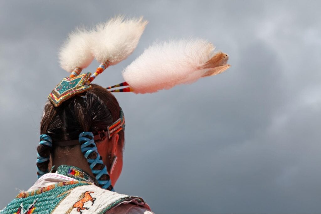 Feather Dance Native American headdress with feathers and beadwork, cultural celebration and spiritual tradition.