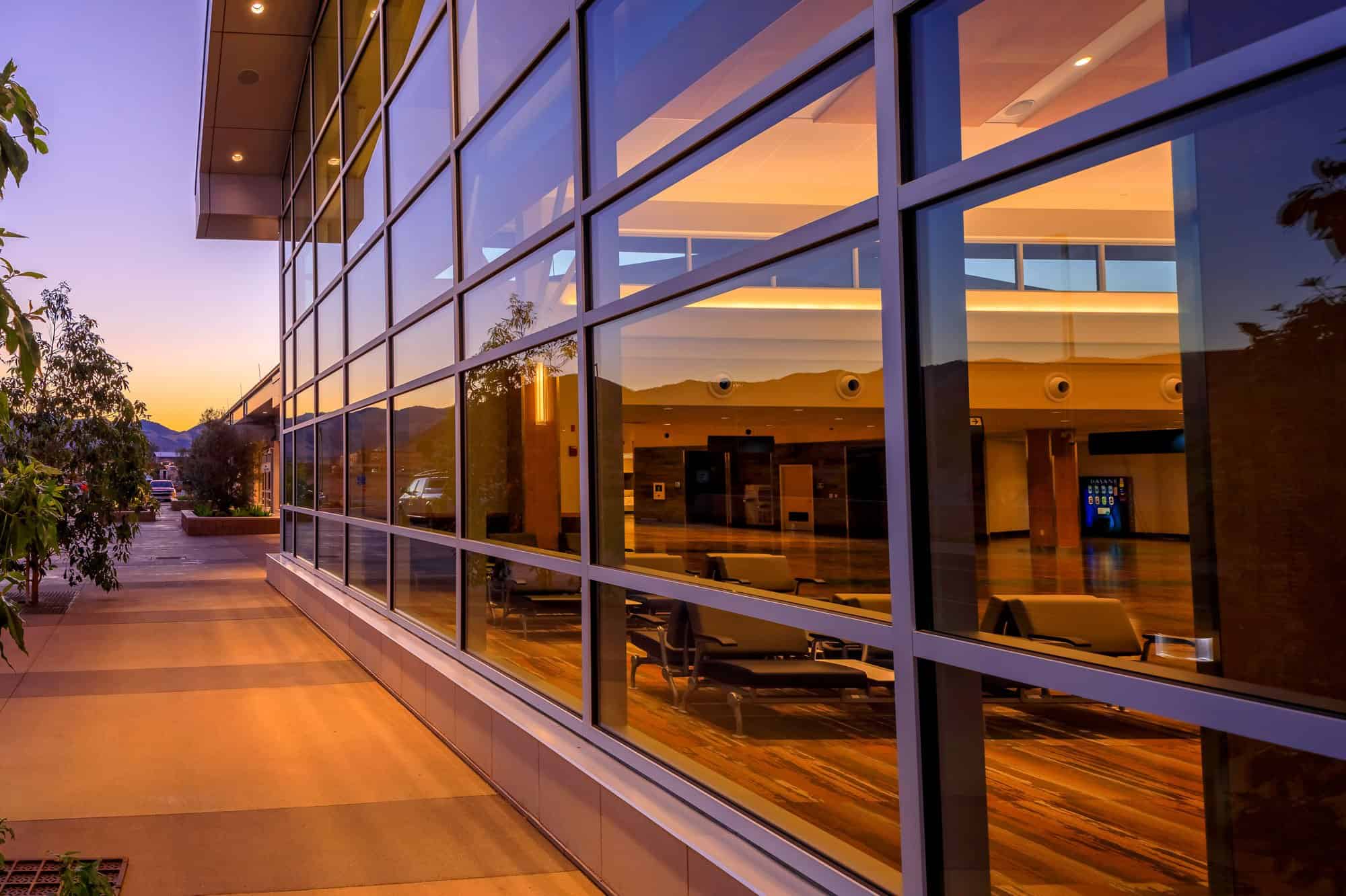 Close up showing the glass window architecture of the SLO County Airport terminal building