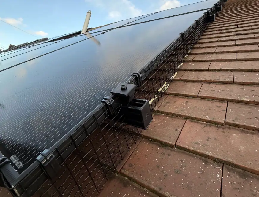 High-quality solar panel installed on a tiled roof, showcasing renewable energy solutions for residential homes. Durable and efficient solar technology for sustainable living.