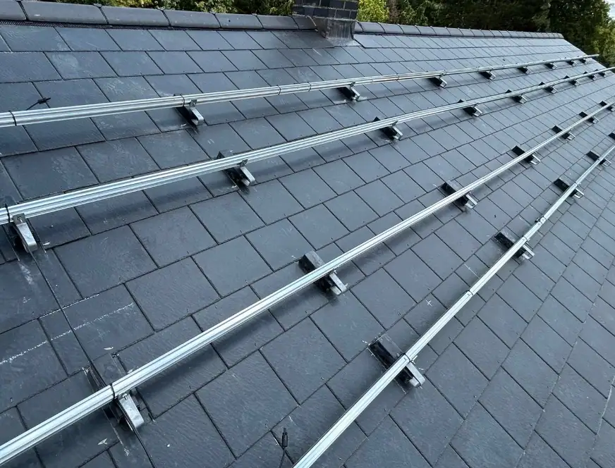 Installation of solar panel mounting rails on a residential roof in Kent, showcasing professional solar panel installation services.