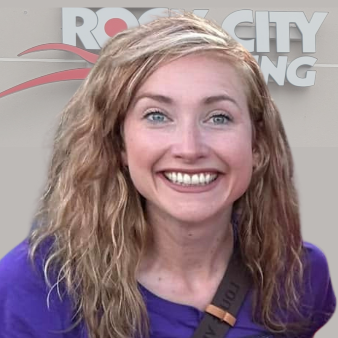 Vibrant woman smiling at Rock City Running store, a premier Little Rock Arkansas running and walking shop with online shopping options.