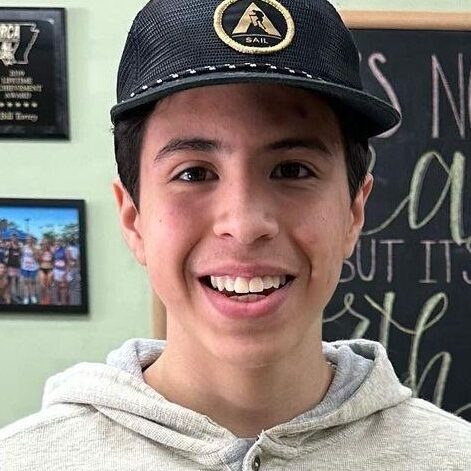 Youth running enthusiast wearing a cap at Rock City Running in Chattanooga, Tennessee.