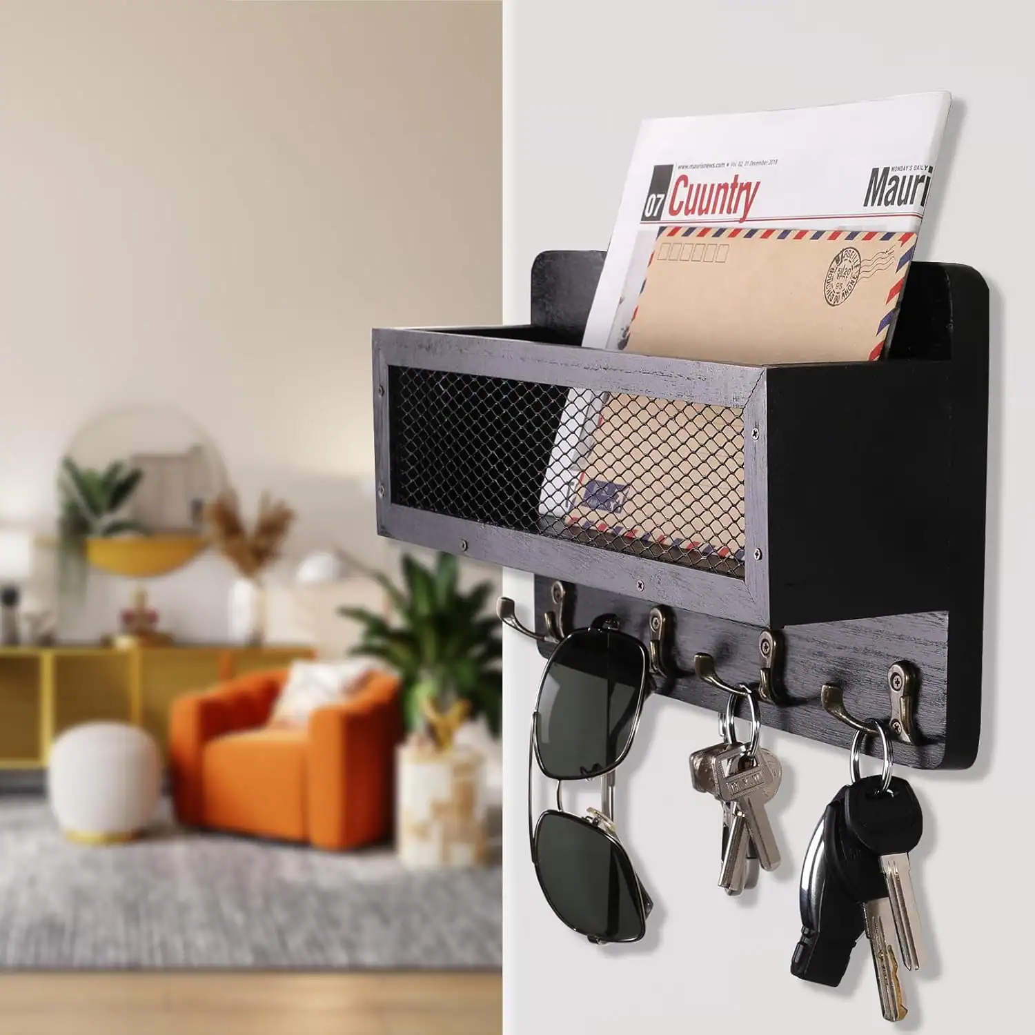 Entryway wall organizer for mail, sunglasses, and keys in a small apartment.