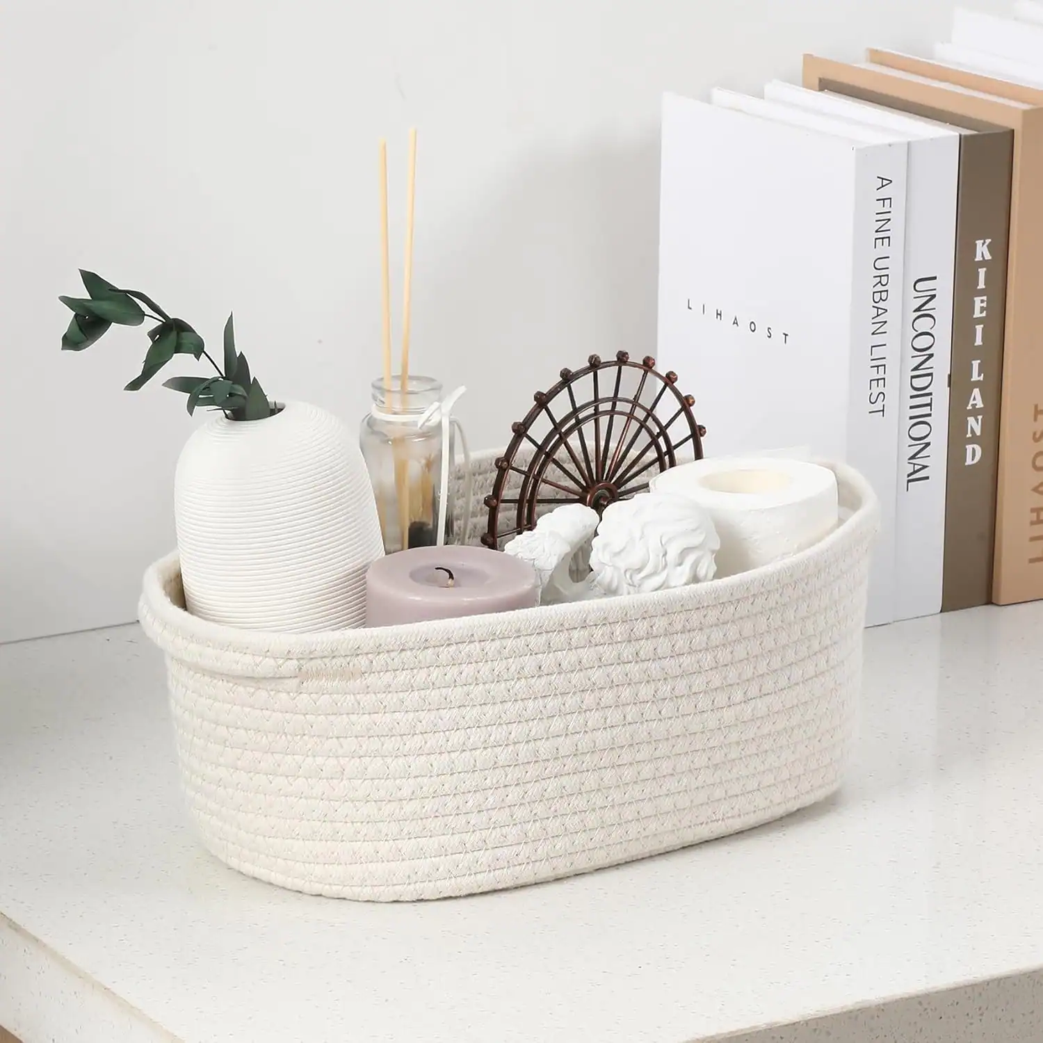 Neat entryway basket with decor, books, and essentials for small apartments.