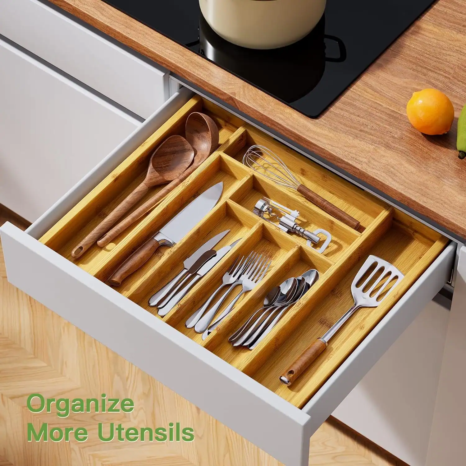 Drawer organizer for kitchen utensils and cutlery storage.
