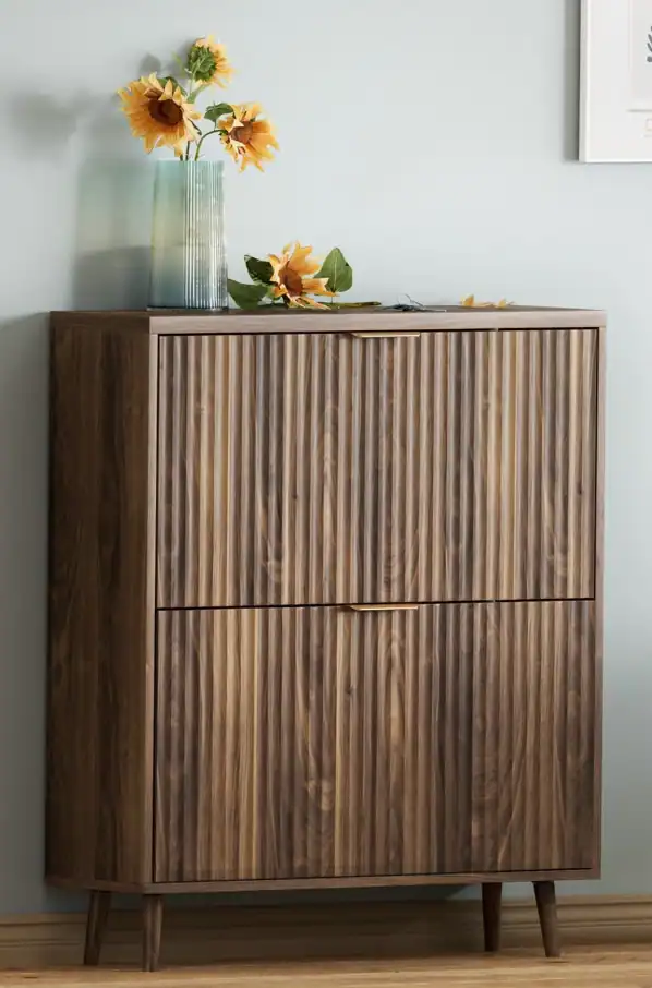 Wooden entryway storage cabinet with sunflower vase and decor.