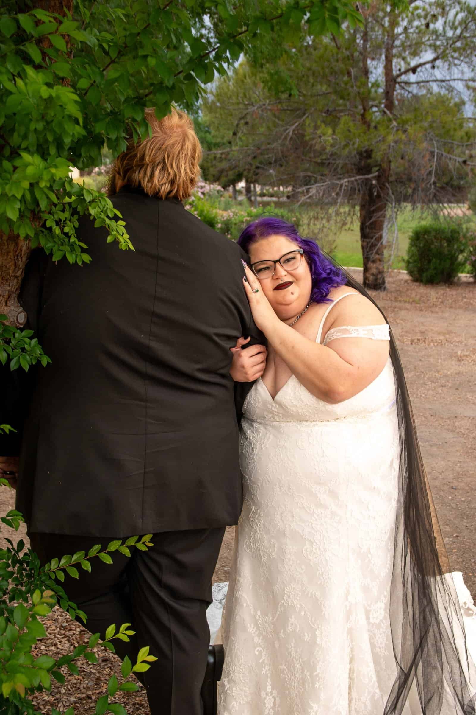 Romantic wedding moment captured in a scenic outdoor location.