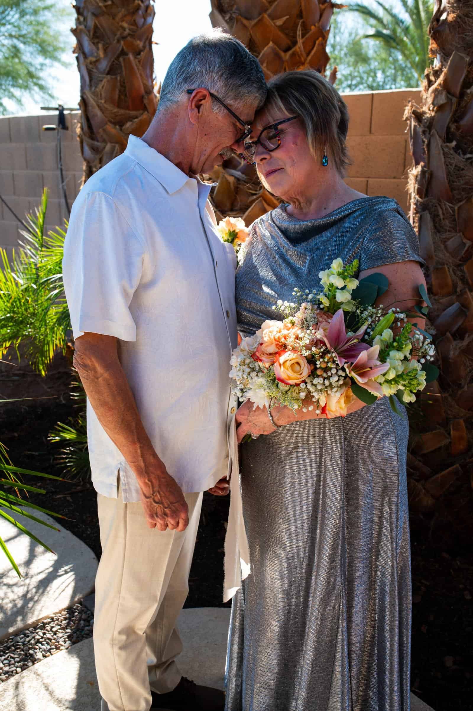 Celebrating a special moment between an elderly couple outdoors, capturing love and companionship.