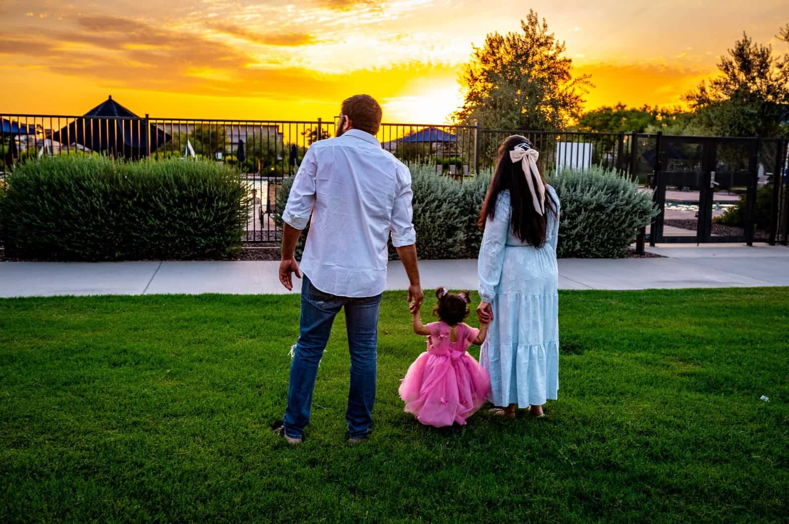 Beautiful family moment during sunset at the park, perfect for wedding or family videos.
