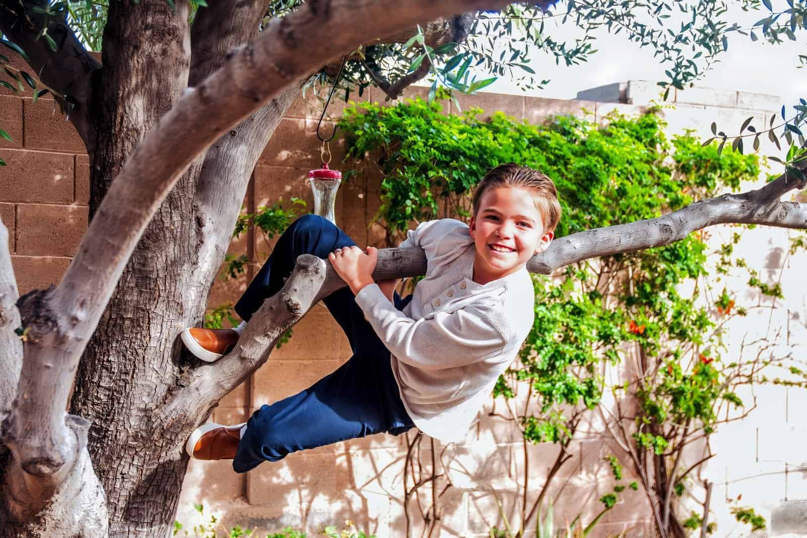Joyful girl enjoying outdoor play on a sunny day in her garden.