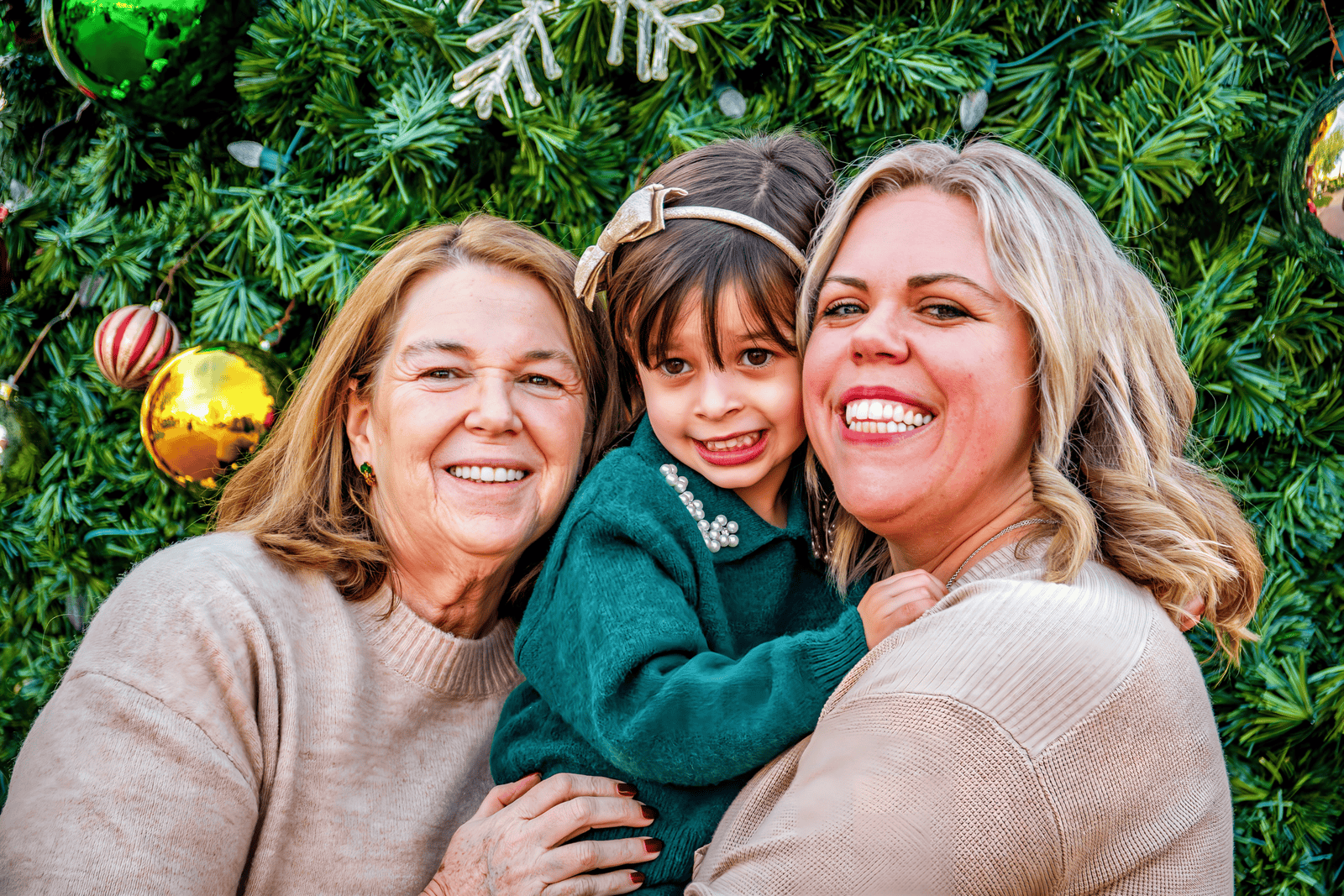 Joyful family photo during Christmas, capturing love and festive spirit.