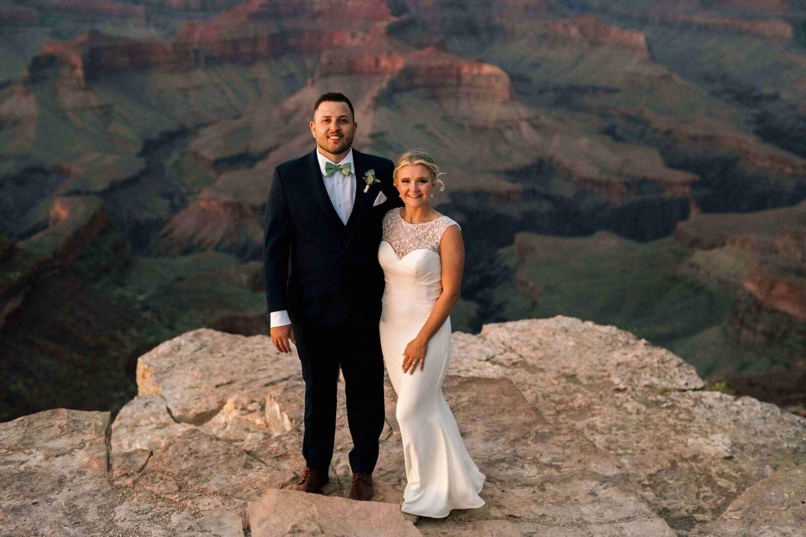 Beautiful wedding photo of a bride and groom at the Grand Canyon, capturing a memorable moment in nature's stunning landscape.