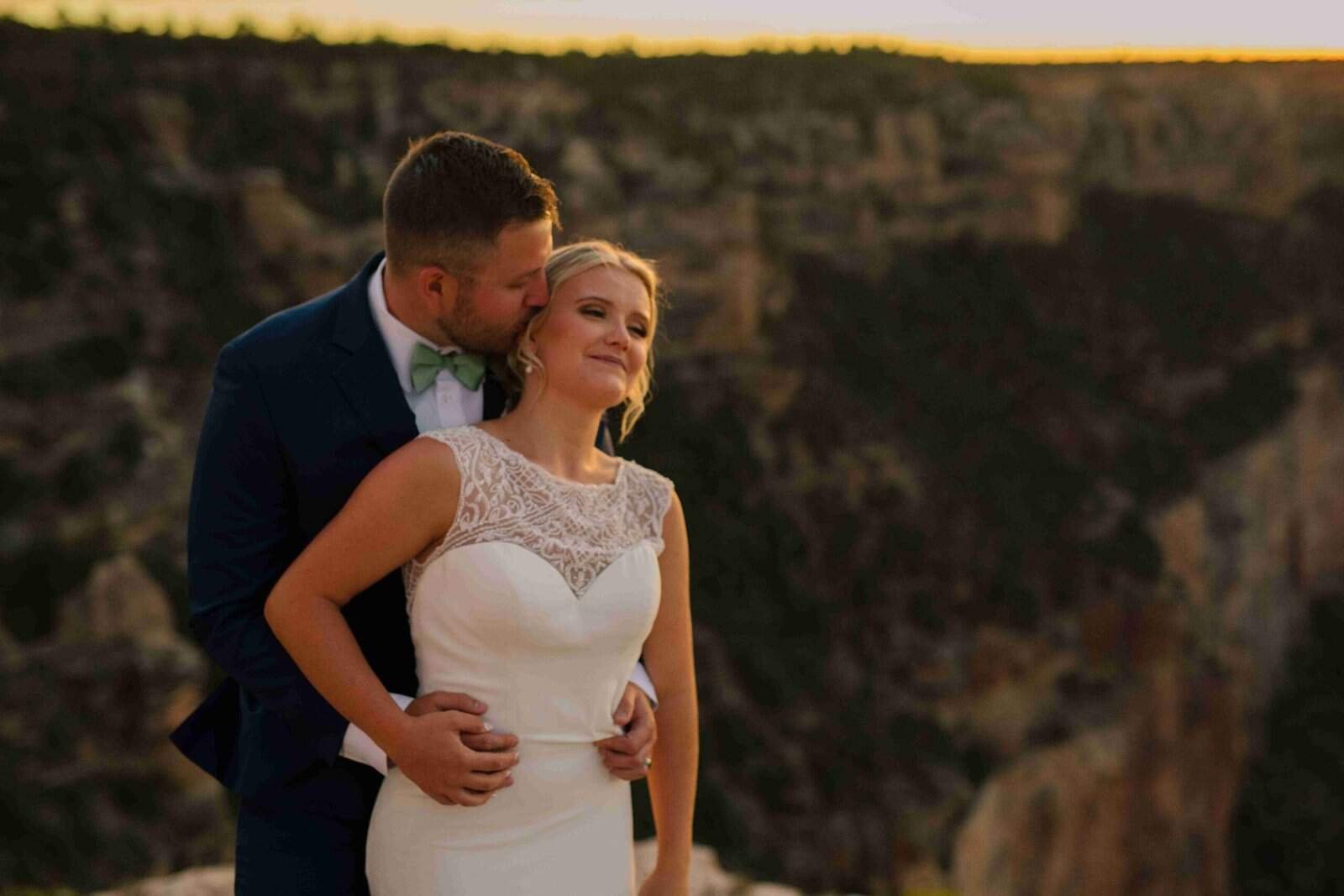 Romantic moment of a bride and groom during sunset, capturing love and happiness on their special day.