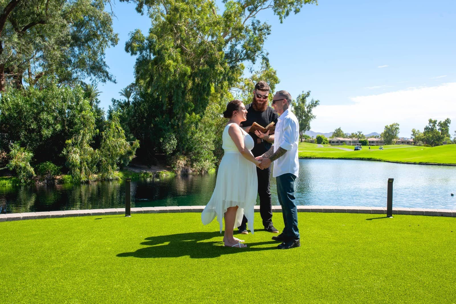 Capturing a heartfelt wedding moment outdoors near the lake, emphasizing love and nature.