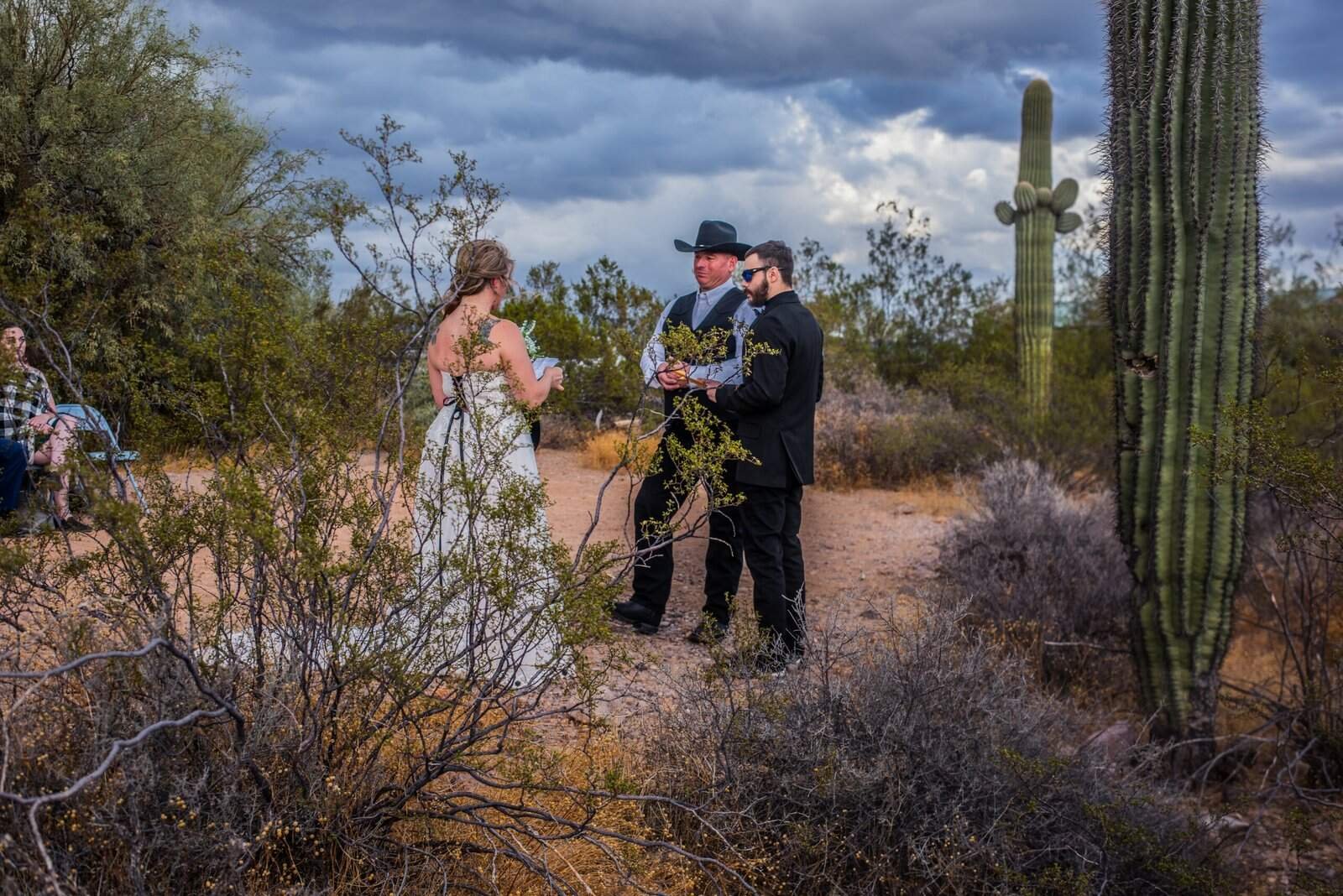 Unique desert wedding ceremony surrounded by cacti and desert flora.