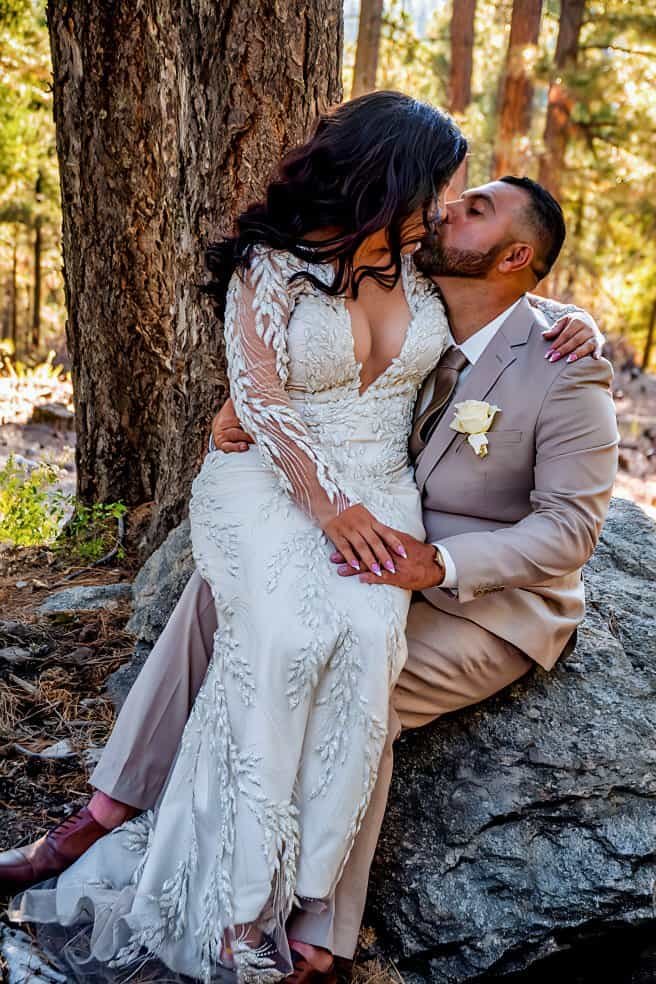 Romantic wedding moment captured in a scenic forest, highlighting love and connection.