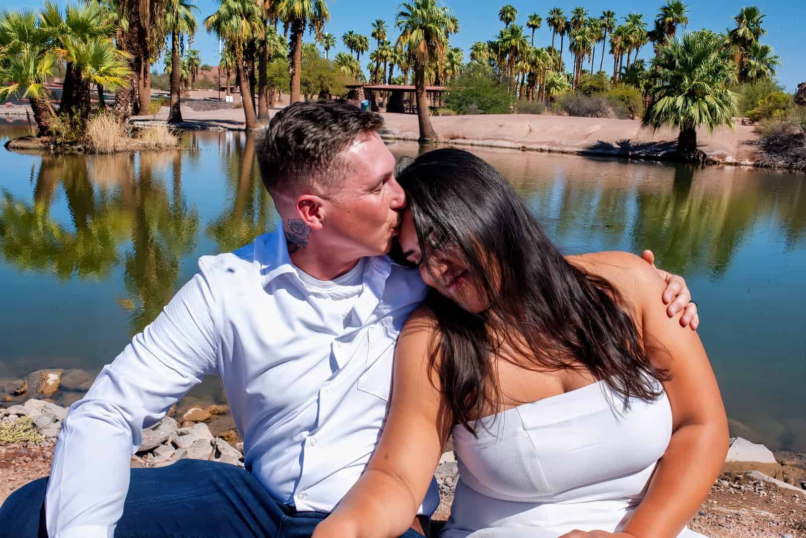 Beautiful couple capturing a special moment during their outdoor engagement photoshoot.