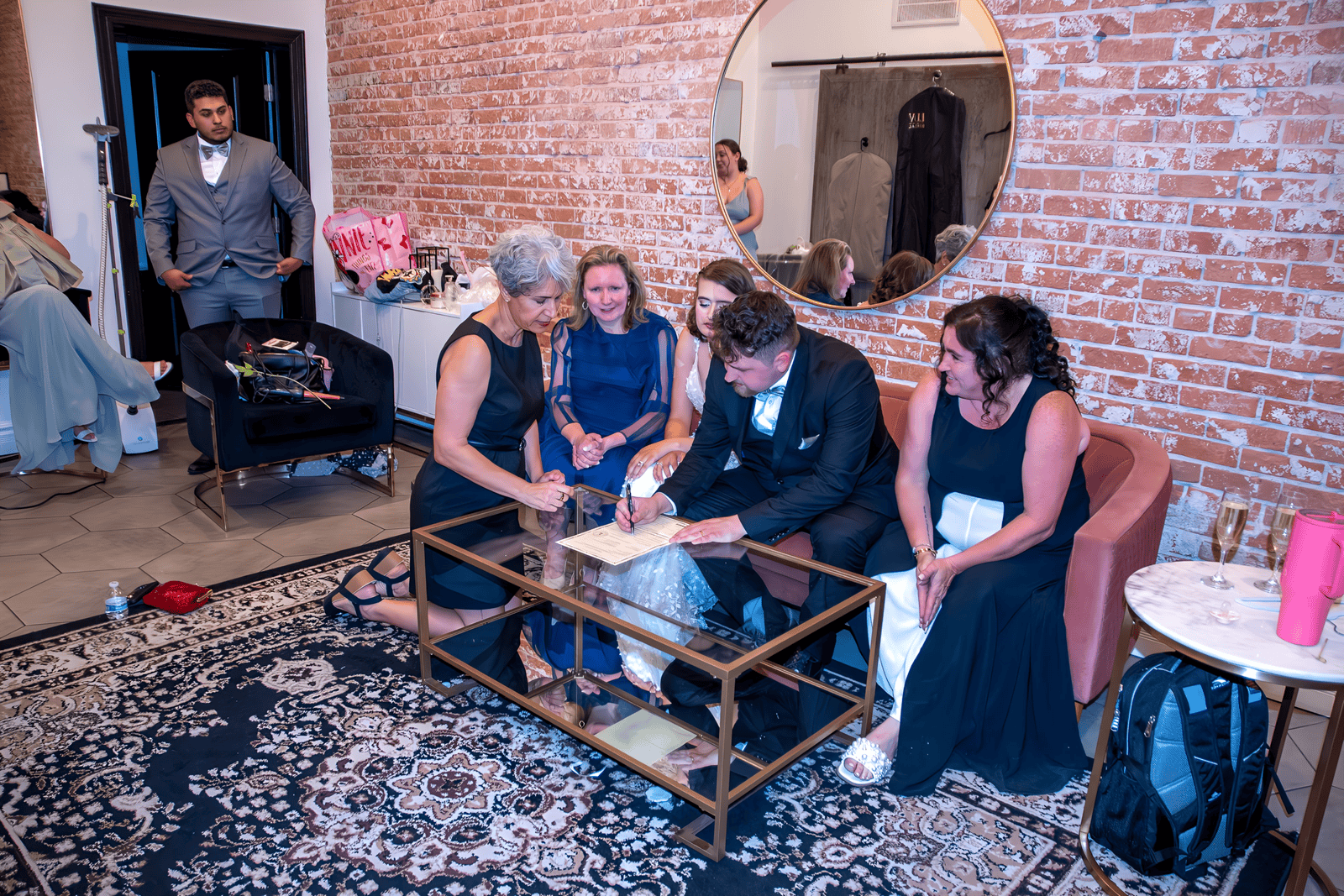 A group of people preparing for a wedding, capturing special moments at a cozy venue.