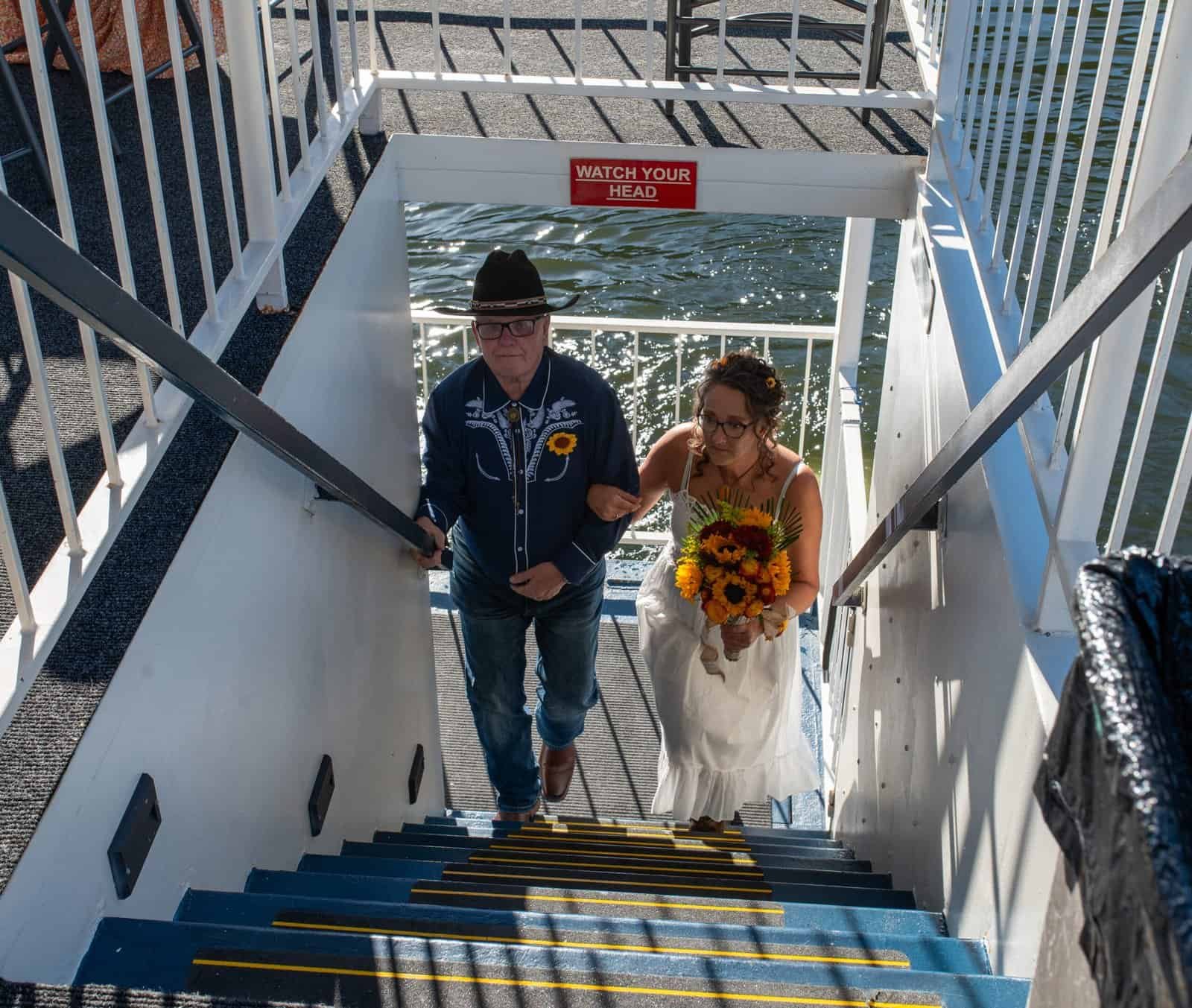 Beautiful wedding moment on a boat with scenic water background.